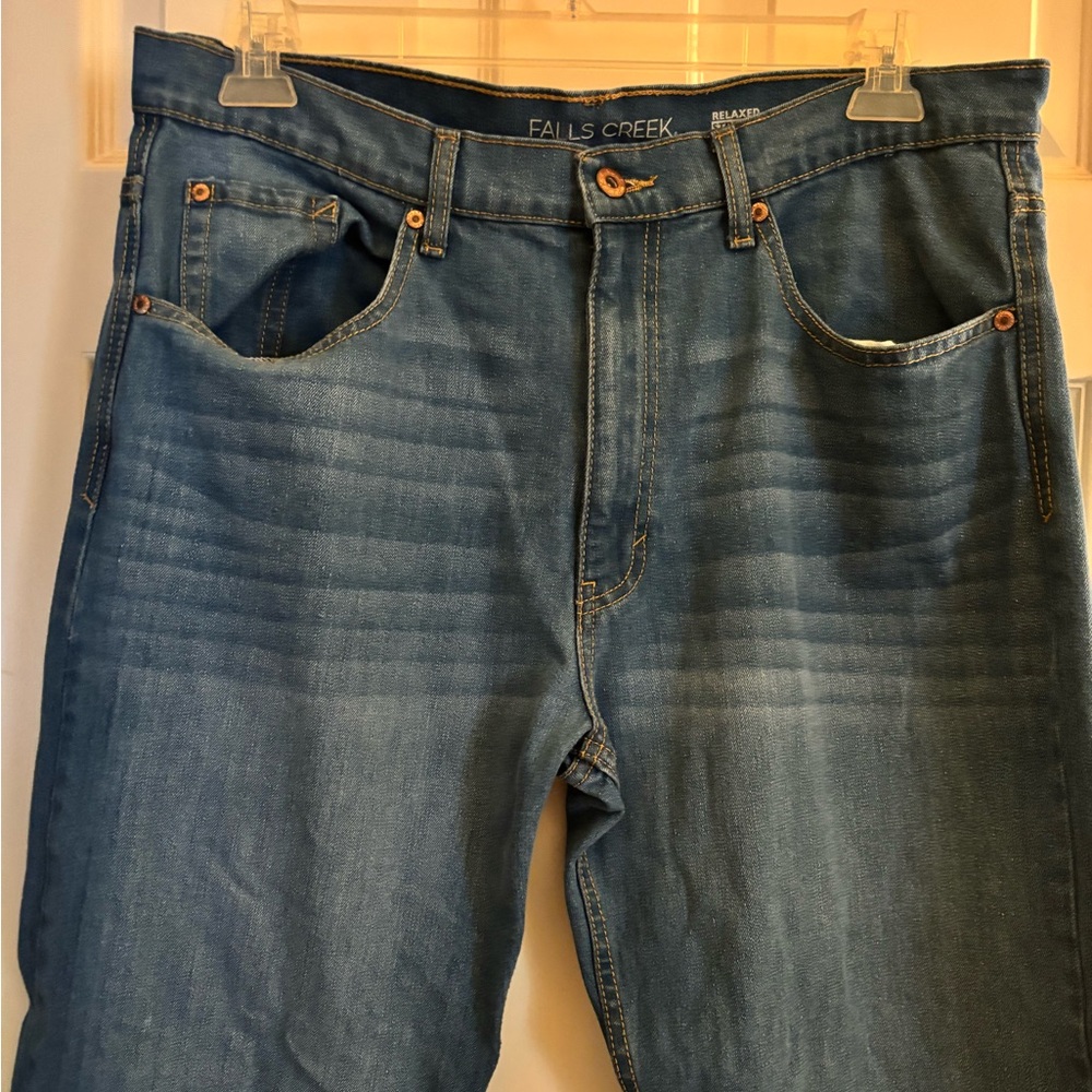 Men’s distressed denim jeans.